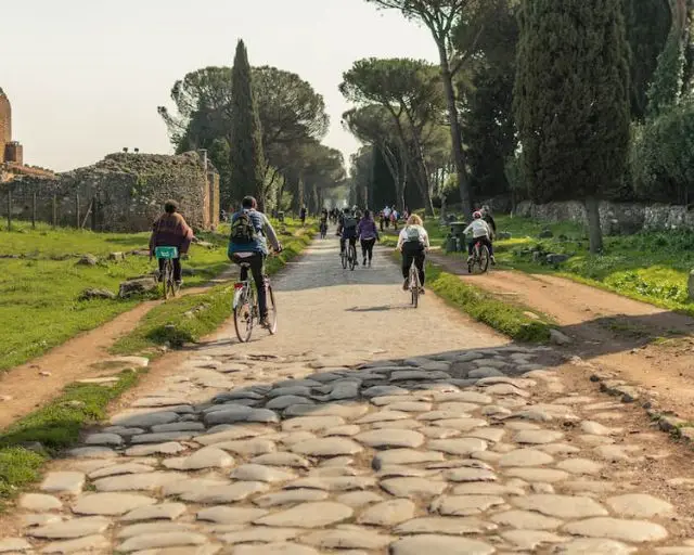 Rally in Rome specialises in tennis and tour combos. Pictured are people cycling down the Appian Way